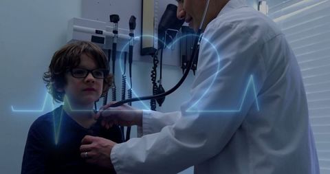 Doctor Examining Young Patient with Digital Cardiograph Overlay