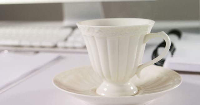 Elegant White Tea Cup on Desk Near Computer Keyboard - Download Free Stock Images Pikwizard.com