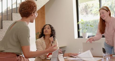 Confident Diverse Female Team Collaborating in Modern Office Setting