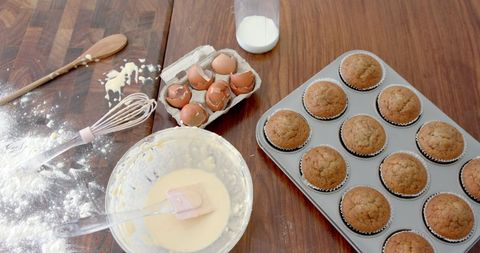 Freshly Baked Cupcakes on Messy Kitchen Table - Download Free Stock Images Pikwizard.com