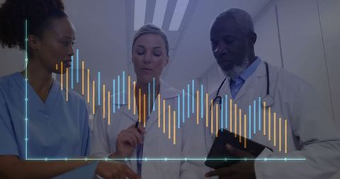 Medical Team Analyzing Data in Hospital Corridor