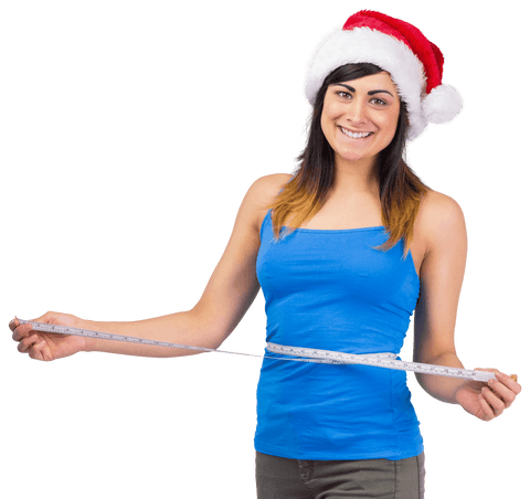 Festive fit woman measuring waist with santa hat transparent
