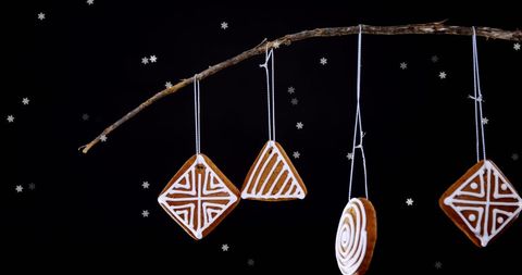 Delicate Christmas Cookies Hanging Against Snowy Black Background - Download Free Stock Images Pikwizard.com