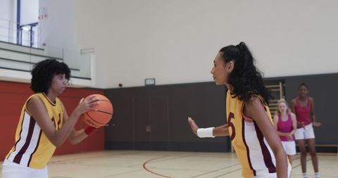 Female Basketball Team Training on Indoor Court