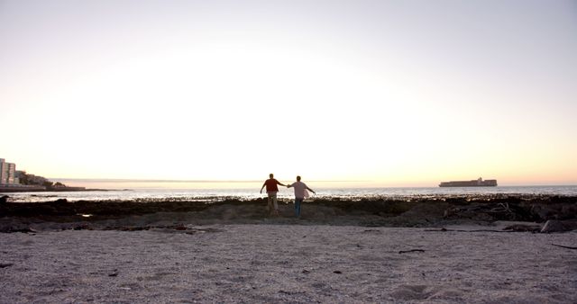 Young Friends Enjoying Beautiful Sunset at the Beach - Download Free Stock Images Pikwizard.com