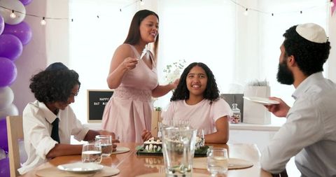 Family Celebrating Traditional Religious Ceremony with Joy and Togetherness