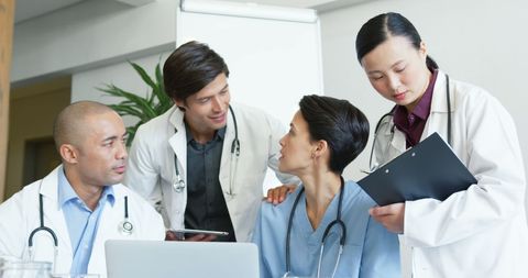 Diverse Medical Team Collaborating on Patient Care in Modern Hospital