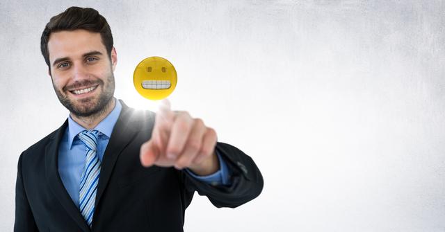 Smiling Businessman Touching Virtual Grinning Emoji Icon - Download Free Stock Photos Pikwizard.com