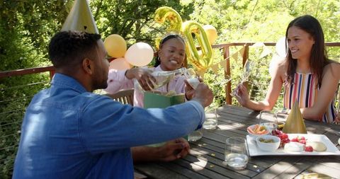 Joyful Birthday Celebration among Friends in Sunny Garden