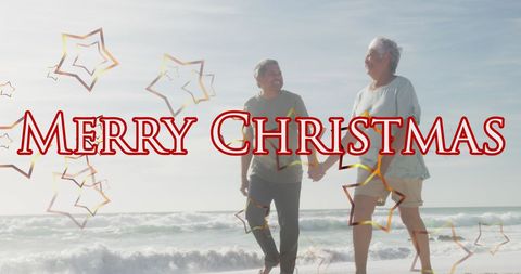 Joyful Senior Couple at Beach During Christmas Celebration