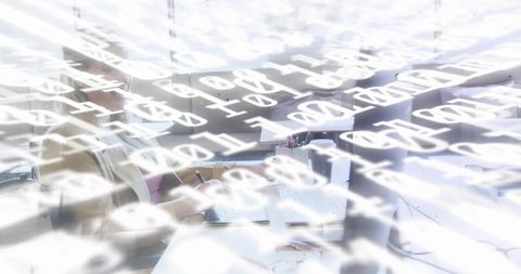 Businesswoman taking notes at desk with floating binary overlay representing data analytics