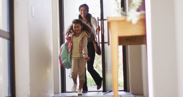 Mother and Daughter Returning Home with Smiling Faces - Download Free Stock Images Pikwizard.com