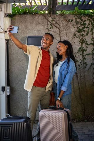 Joyful Couple Taking Selfie on Vacation