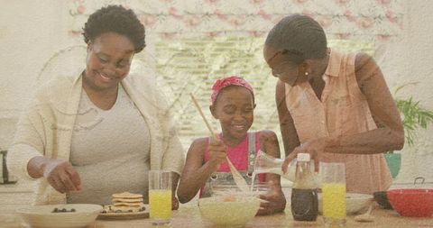 African American Family Bonding While Joyfully Baking Together