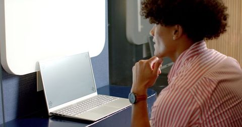 Professional Man Using Laptop in Contemporary Office