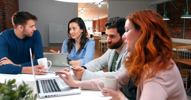 Diverse Team Discussing During Informal Meeting in Modern Office - Download Free Stock Images Pikwizard.com