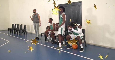 Sideline energy cheering basketball team motivating coach on bench during game break