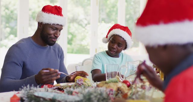 Family Enjoying Christmas Meal Together Wearing Santa Hats - Download Free Stock Images Pikwizard.com