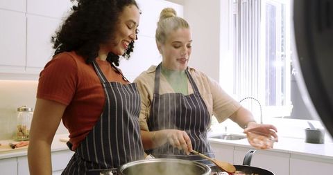 Diverse Female Friends Cooking in Modern Kitchen