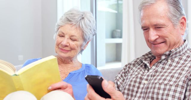 Senior Couple Relaxing at Home with Books and Media Devices - Download Free Stock Images Pikwizard.com