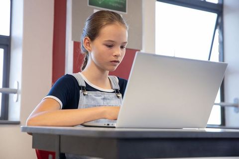 Attentive Teenage Girl Engaged in Online Learning