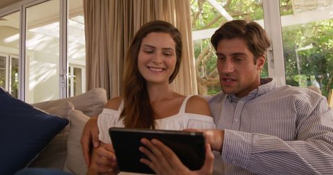 Happy Couple Relaxing Indoors with Tablet Technology - Download Free Stock Images Pikwizard.com