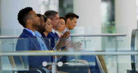 Diverse Business Professionals Applauding at Seminar