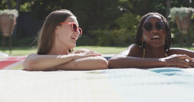 Two Women Relaxing and Enjoying Pool Time Together - Download Free Stock Images Pikwizard.com