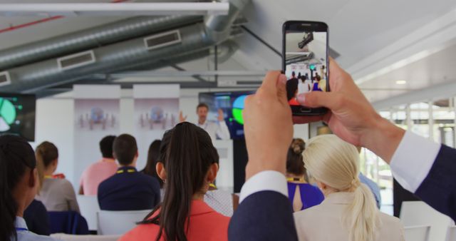 Audience Member Filming Business Presentation on Smartphone - Download Free Stock Images Pikwizard.com