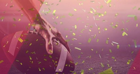 Victory Celebration: American Football Player Holding Ball with Gold Confetti