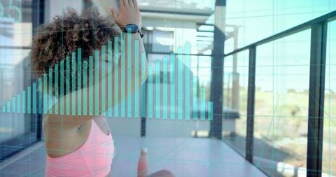 Urban balcony yoga stretching woman wearing smartwatch with teal analytics overlay