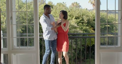 Romantic Couple Taking Selfie on Balcony with Scenic View