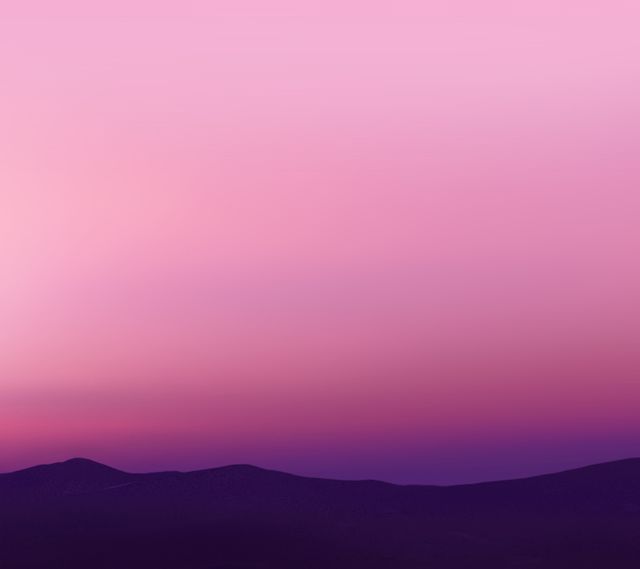 Perfect for backgrounds, website headers, or relaxation-themed projects, this image displays a calming pink and purple sunset over silhouetted mountains, evoking a sense of tranquility and natural beauty.