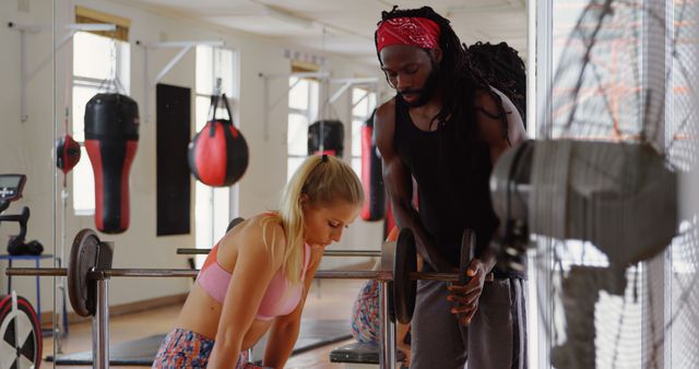 Personal Trainer Assisting Woman with Barbell Workout in Gym - Download Free Stock Images Pikwizard.com