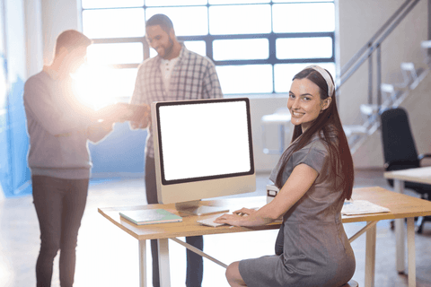 businesswoman sitting confidently at transparent computer desk in office - Download Free Stock Videos Pikwizard.com