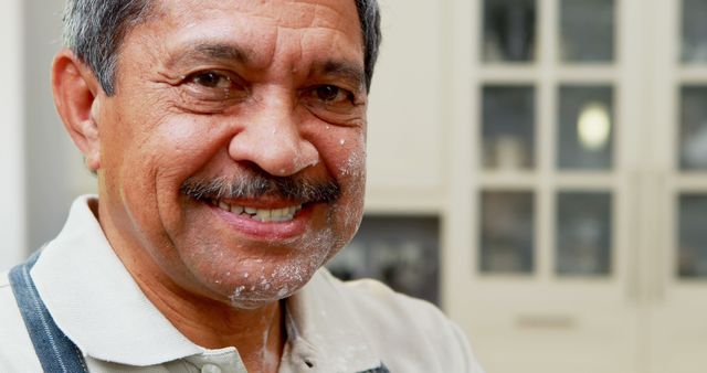 Smiling Senior Man with Flour on Face in Kitchen - Download Free Stock Images Pikwizard.com