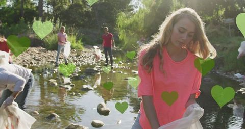 Eco Volunteers Cleaning River with Green Heart Graphics - Download Free Stock Images Pikwizard.com