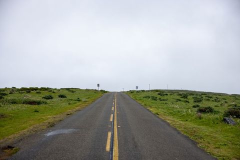 Empty Rural Road Under Overcast Sky