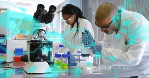 Pipetting samples into microplate at lab bench with microscope, collaborating for precise research o