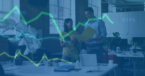 Professionals Analyzing Data in Modern Open Office Environment