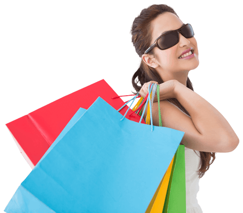 Brunette woman holding colorful shopping bags wearing sunglasses