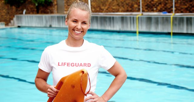 Smiling Female Lifeguard Holding Rescue Tube by Poolside - Download Free Stock Images Pikwizard.com