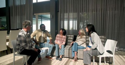 Diverse group engaged in interactive therapy session