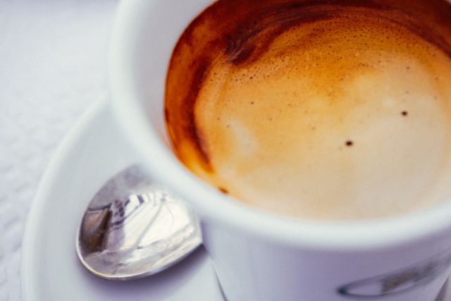 Close-Up of Freshly Brewed Espresso in White Cup - Download Free Stock Photos Pikwizard.com