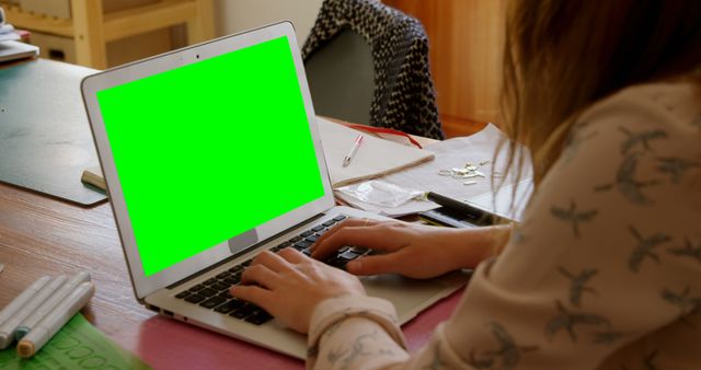 Woman Using Laptop with Green Screen at Desk - Download Free Stock Images Pikwizard.com