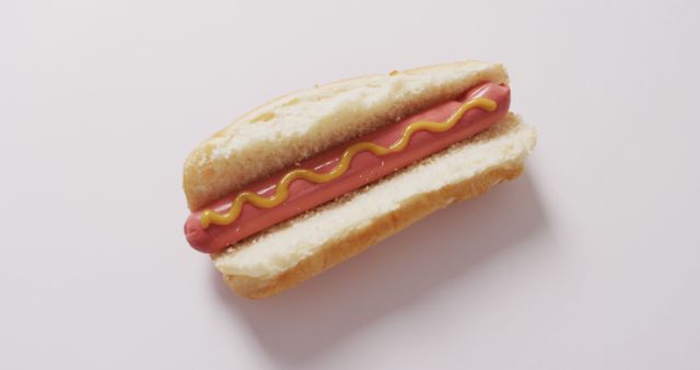 Classic Hot Dog with Mustard on a Plain Background - Download Free Stock Images Pikwizard.com