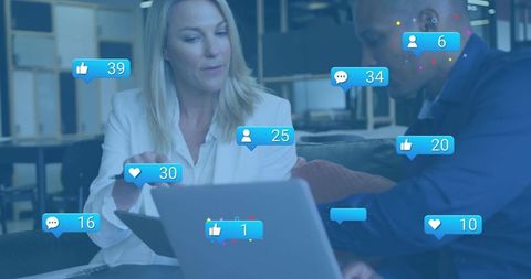 Business team reviewing analytics on laptop with social media engagement overlays