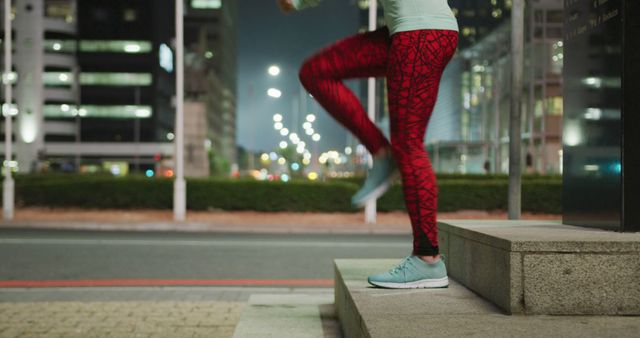 Person Exercising Outdoors at Night in the City Wearing Red Leggings - Download Free Stock Images Pikwizard.com