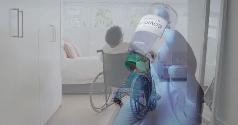 Doctor Preparing COVID-19 Vaccine for Patient in Wheelchair