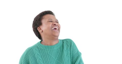 Joyful Woman in Green Sweater Laughing Against White - Download Free Stock Images Pikwizard.com